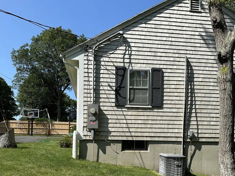 Electrical service on the side of a Cape Cod home